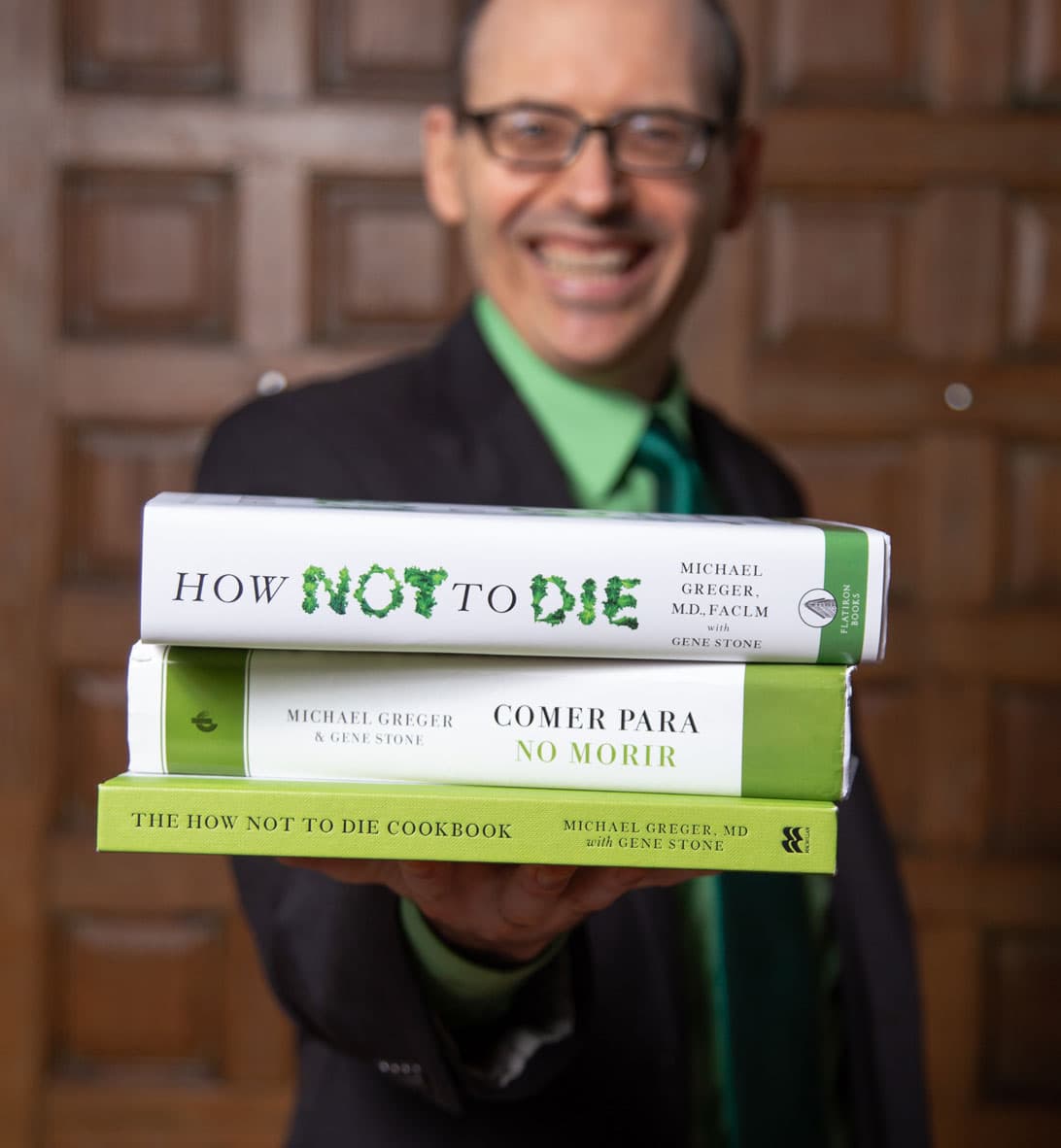 Picture of Michael Greger holding his books