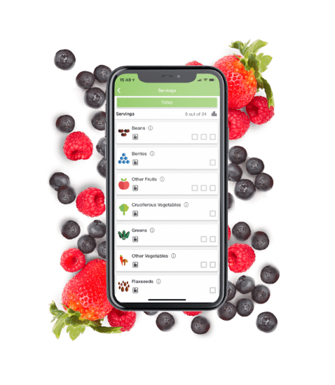 Phone with Daily Dozen app surrounded by berries