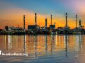smoke stacks over water