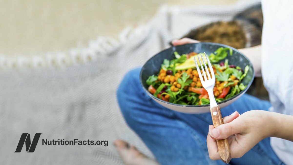 person eating salad