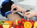 nurse taking blood pressure with fruit on the bottom of photo