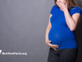 pregnant woman looks nauseated
