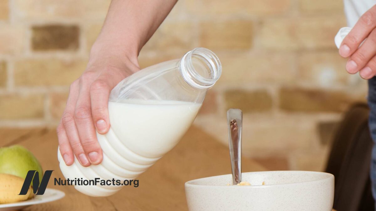 hand holding bottle of milk