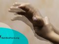 Closeup view on the shaking hand of a person suffering from Parkinson's disease