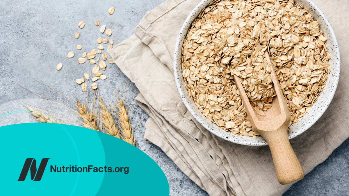 Oat flakes, oats or rolled oats in a bowl on a stone countertop