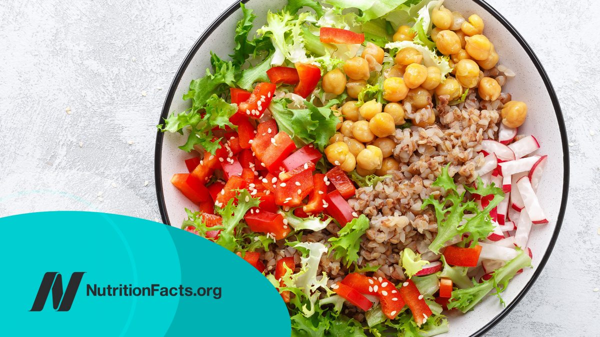 bowl with buckwheat and salad of chickpea, fresh pepper and lettuce leaves