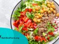 bowl with buckwheat and salad of chickpea, fresh pepper and lettuce leaves