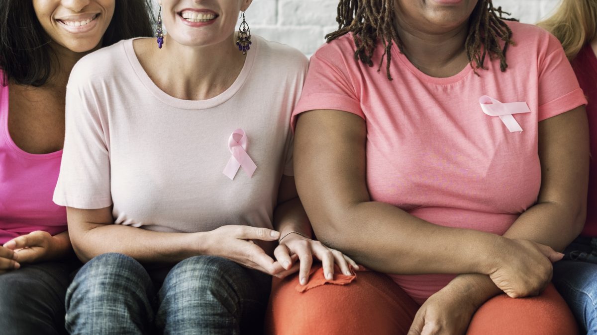 group of ladies with breast cancer ribbon