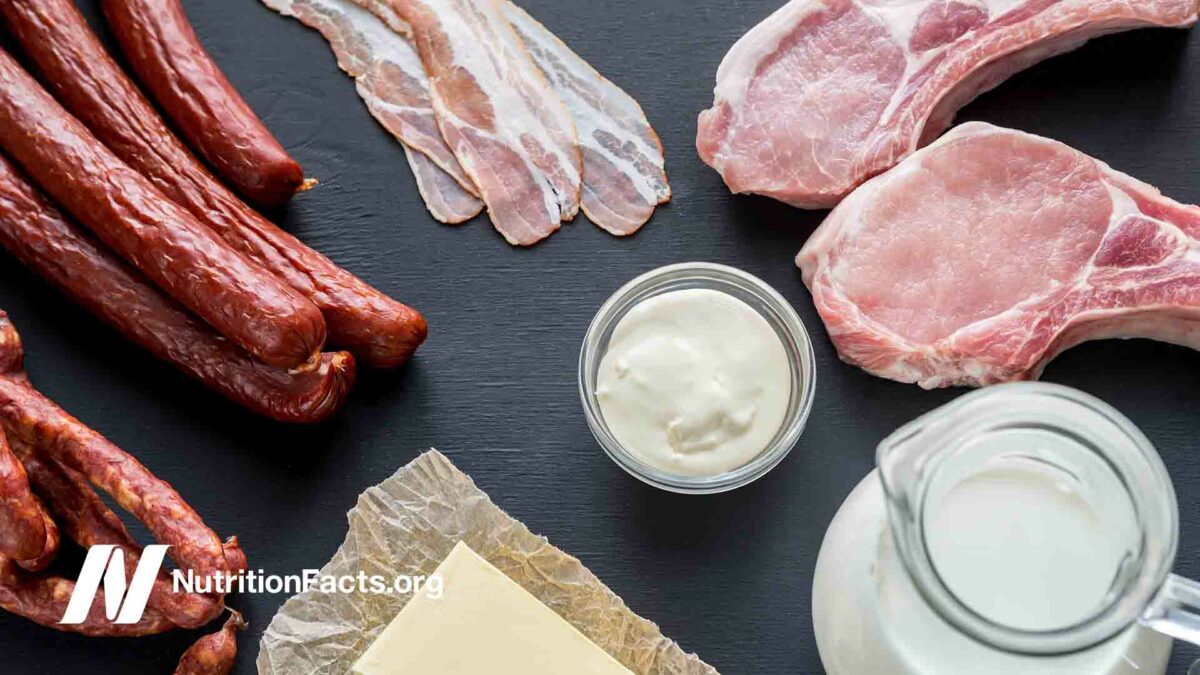 Assortment of dairy and meat products on dark countertop