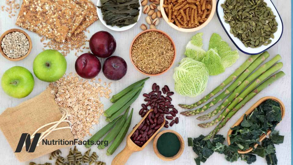 High-fiber superfoods with whole grain crackers, fruits, vegetables, whole wheat pasta, seeds and nuts