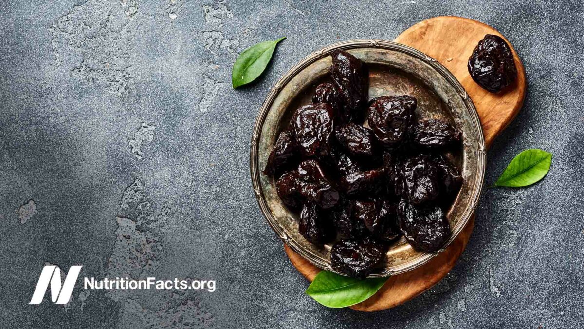 Dried prunes on plate