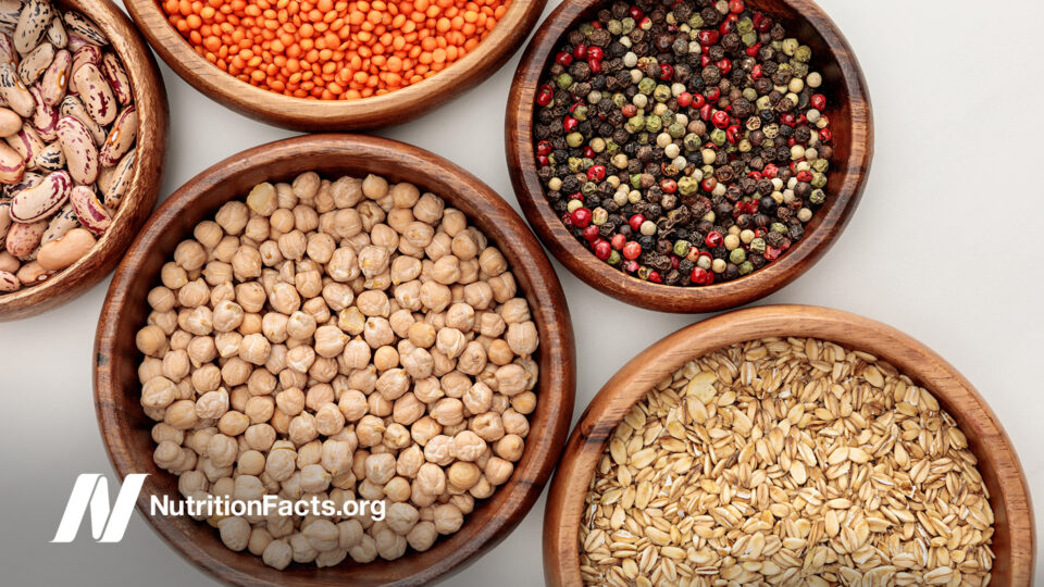 wooden bowls containing legumes and grains