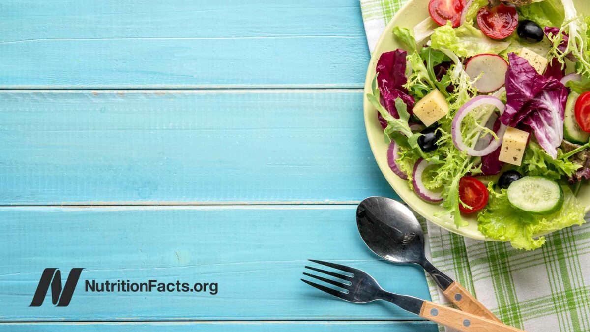 blue picnic table with a vegetable salad