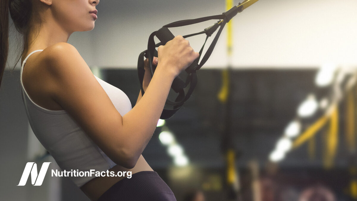 woman participating in TRX exercise