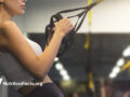 woman participating in TRX exercise