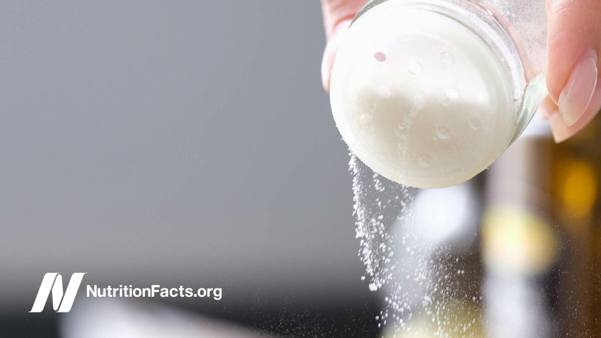 close up of salt shaker with salt pouring out