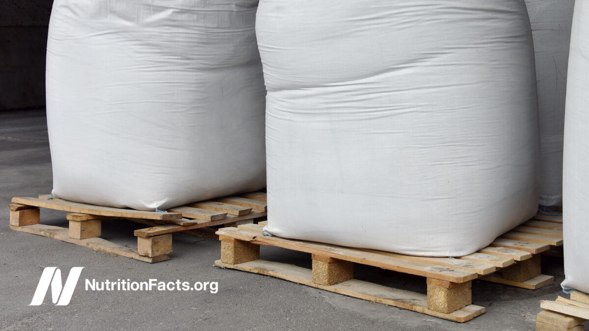 bags of sugar on palettes in a warehouse