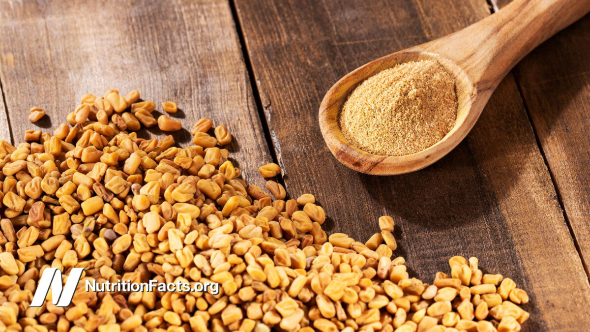 fenugreek seeds and powder over wood surface