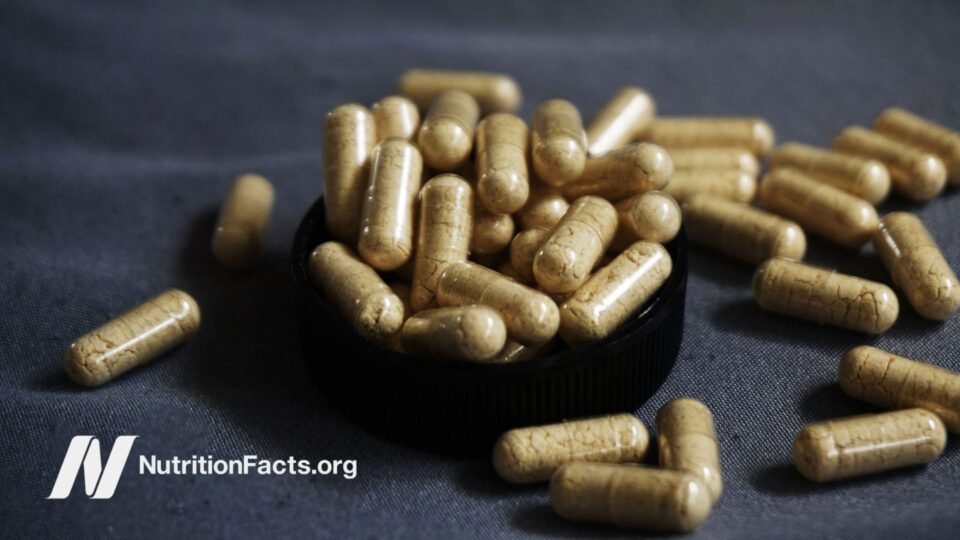 Vitamin capsules on a dark background