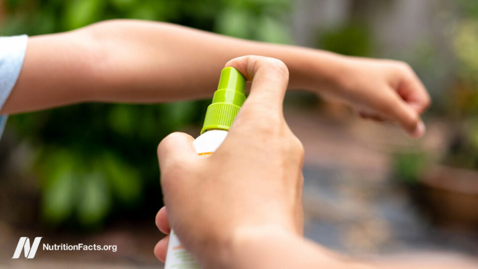 Person spraying a child's wrist