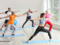 A group of people taking a yoga class