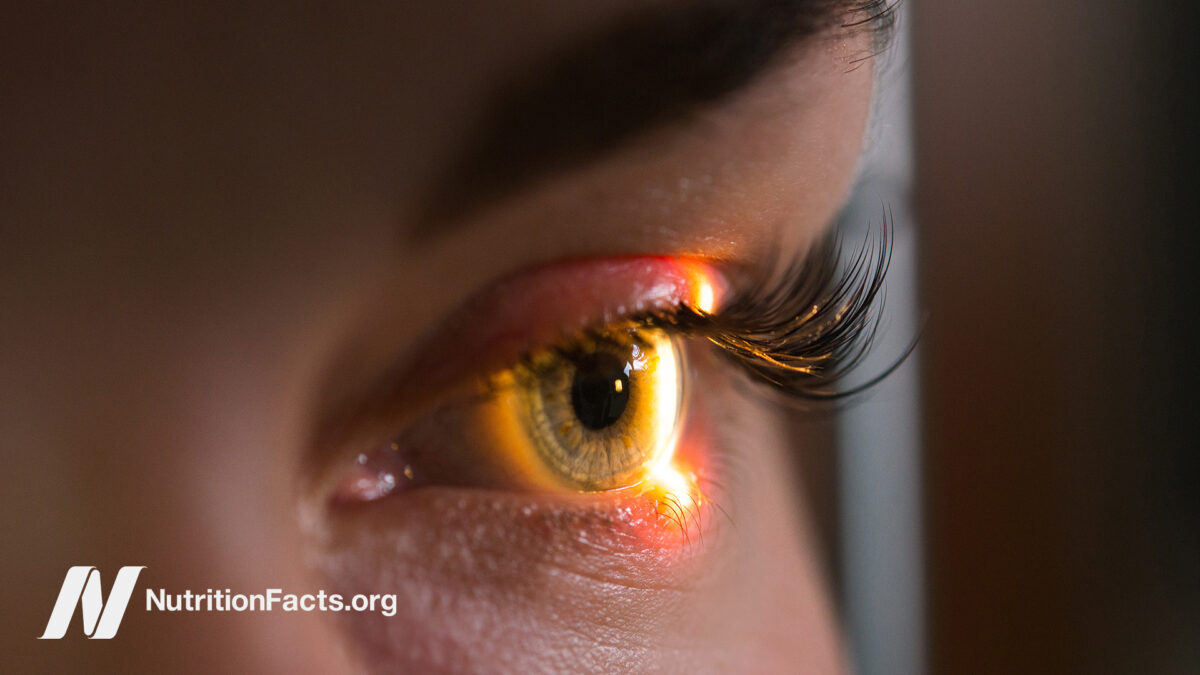 close-up of an eye with light shining on it