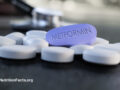 Tablets labeled metformin on a table