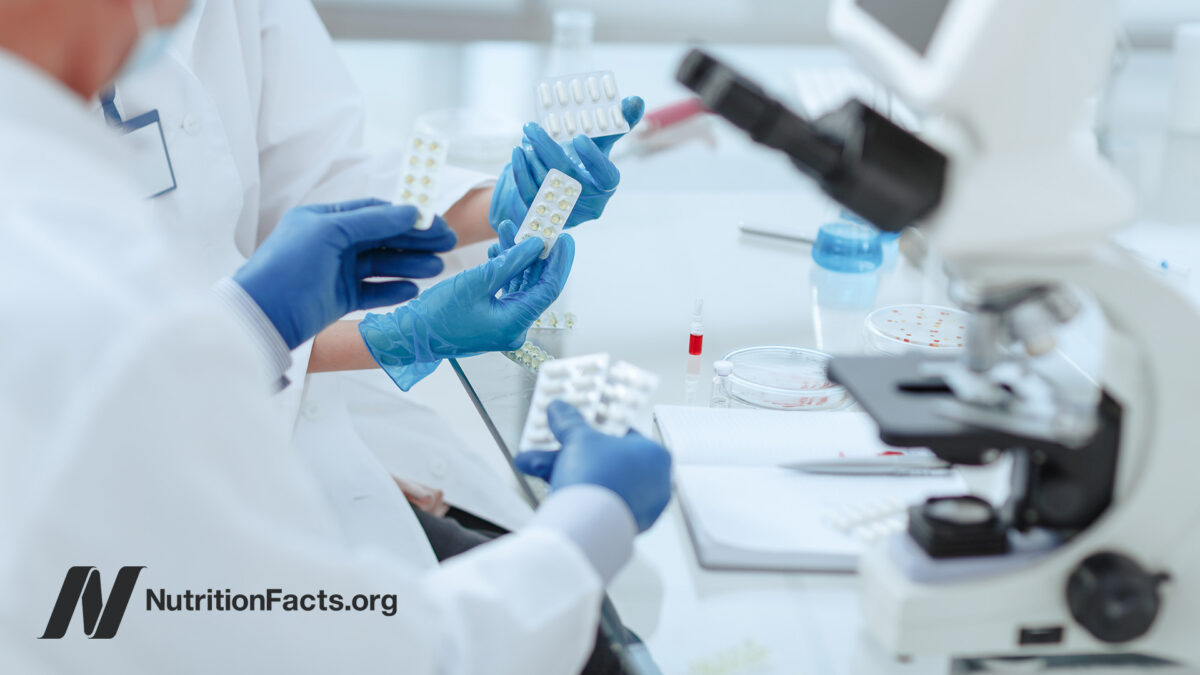 Doctors in a lab using testing equipment