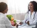 A medical professional advising their patient on nutrition