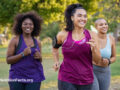 Three happy women running outdoors