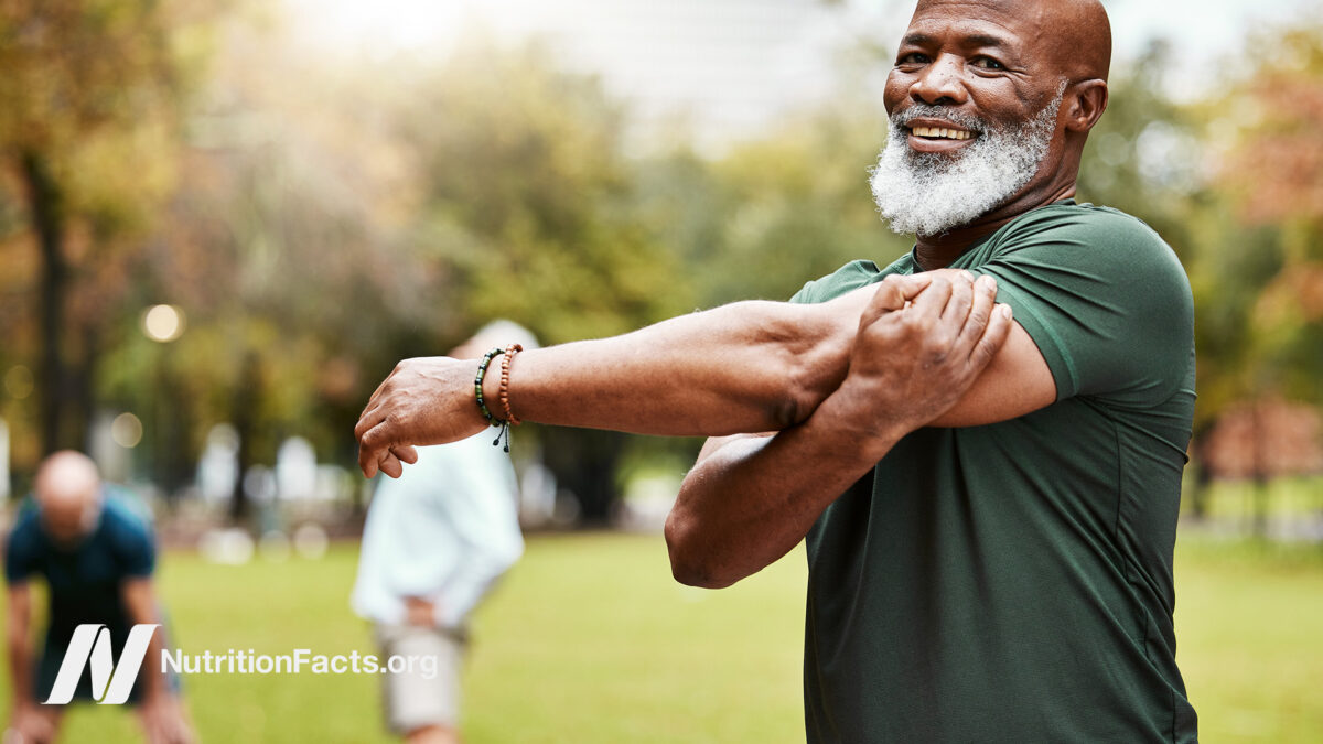 Older male stretching after exercising