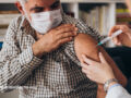 Older patient receiving a vaccination
