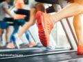 People exercising on treadmills at the gym