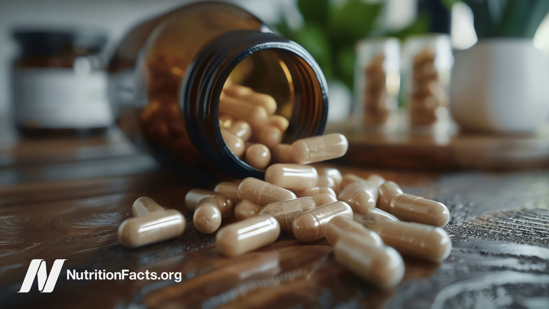 Supplement capsules from a container on a wooden table