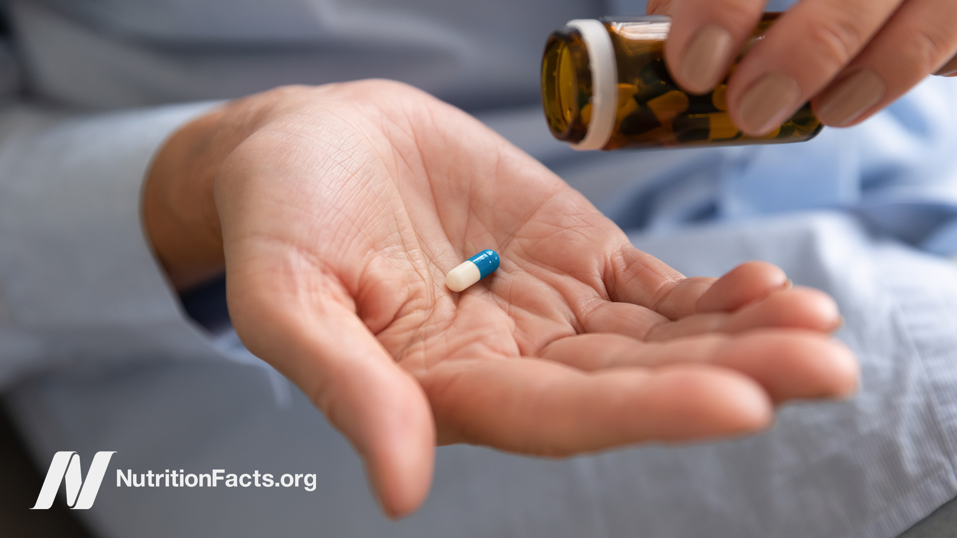 Dumping a capsule into the palm of a hand