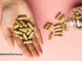 Powder capsules from a jar into the palm of a hand