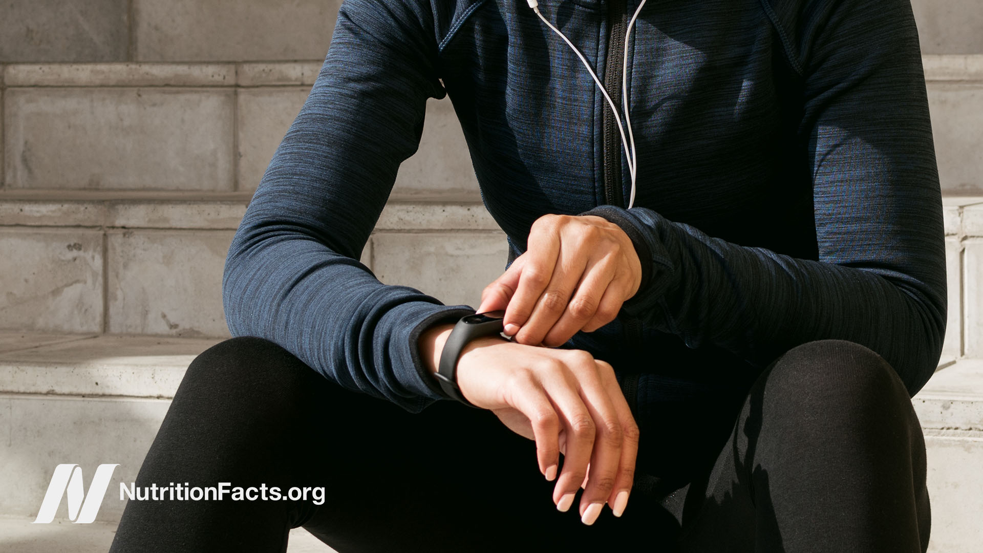 Woman checking her fitness tracker on her wrist