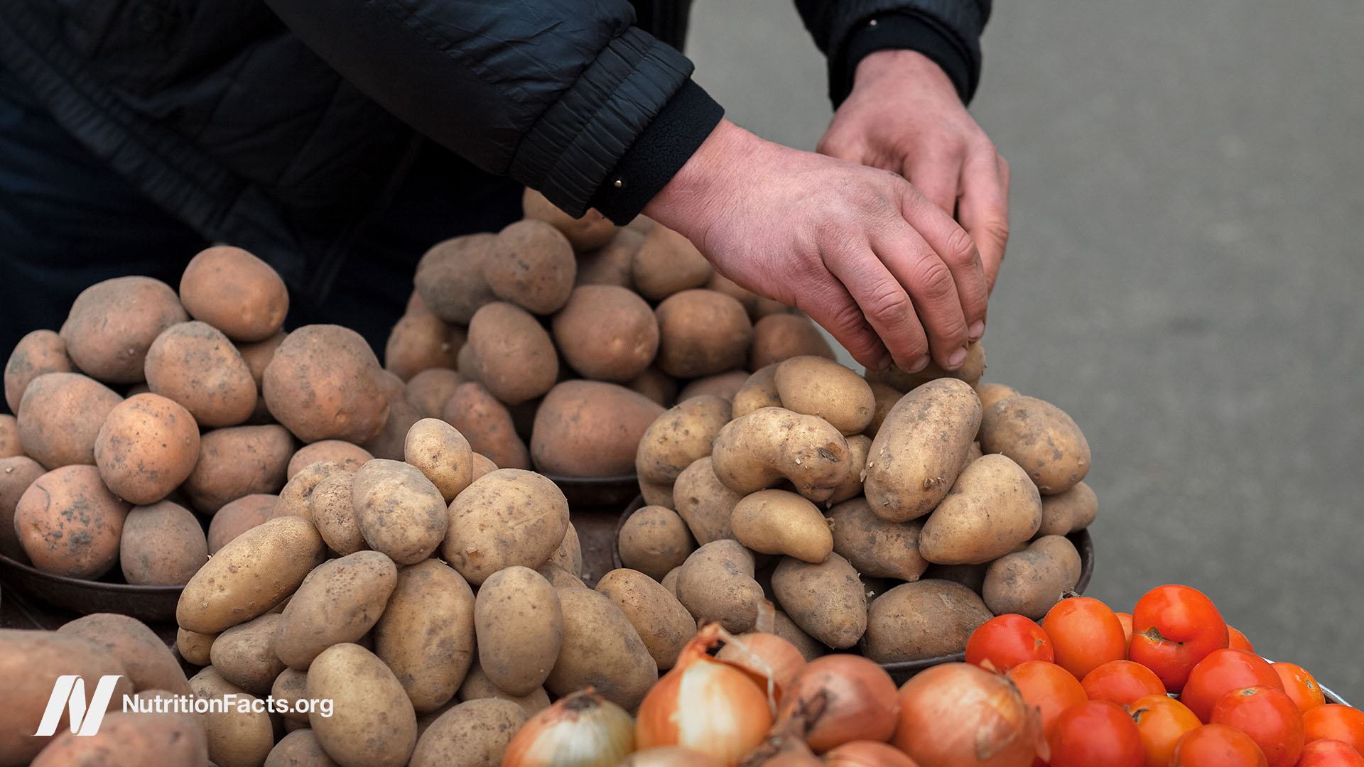 person sorting potatoes