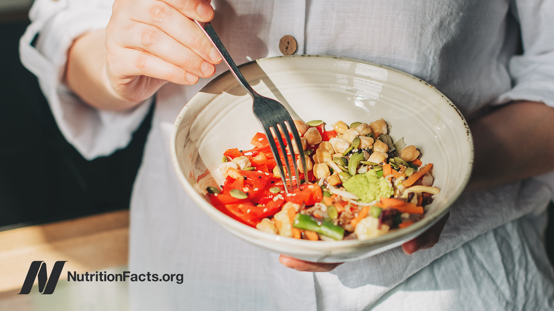 Person eating plant-based meal out of a bowl