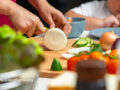 Mother and child preparing a vegetable-heavy meal