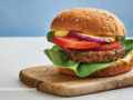 Lentil-Walnut burger on a wooden cutting board