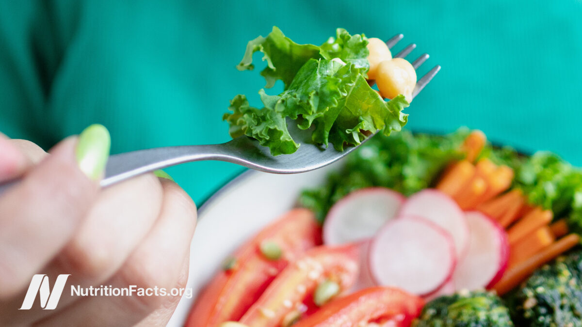 Plant-based meal being eaten by a person with a fork