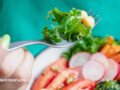 Plant-based meal being eaten by a person with a fork