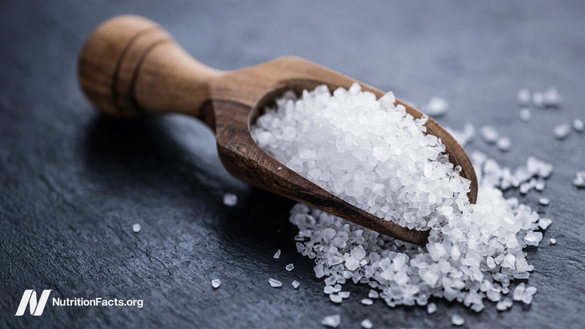 wooden spoon with salt grains