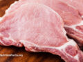 Raw pork meat on a cutting board