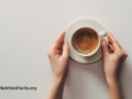 Woman holding a coffee cup