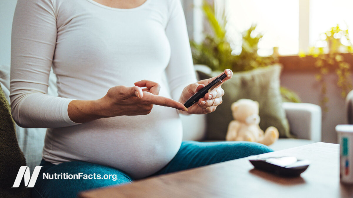 Diabetic pregnant person using a blood glucose meter