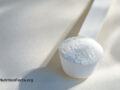 Close up view of a scoop of taurine powder