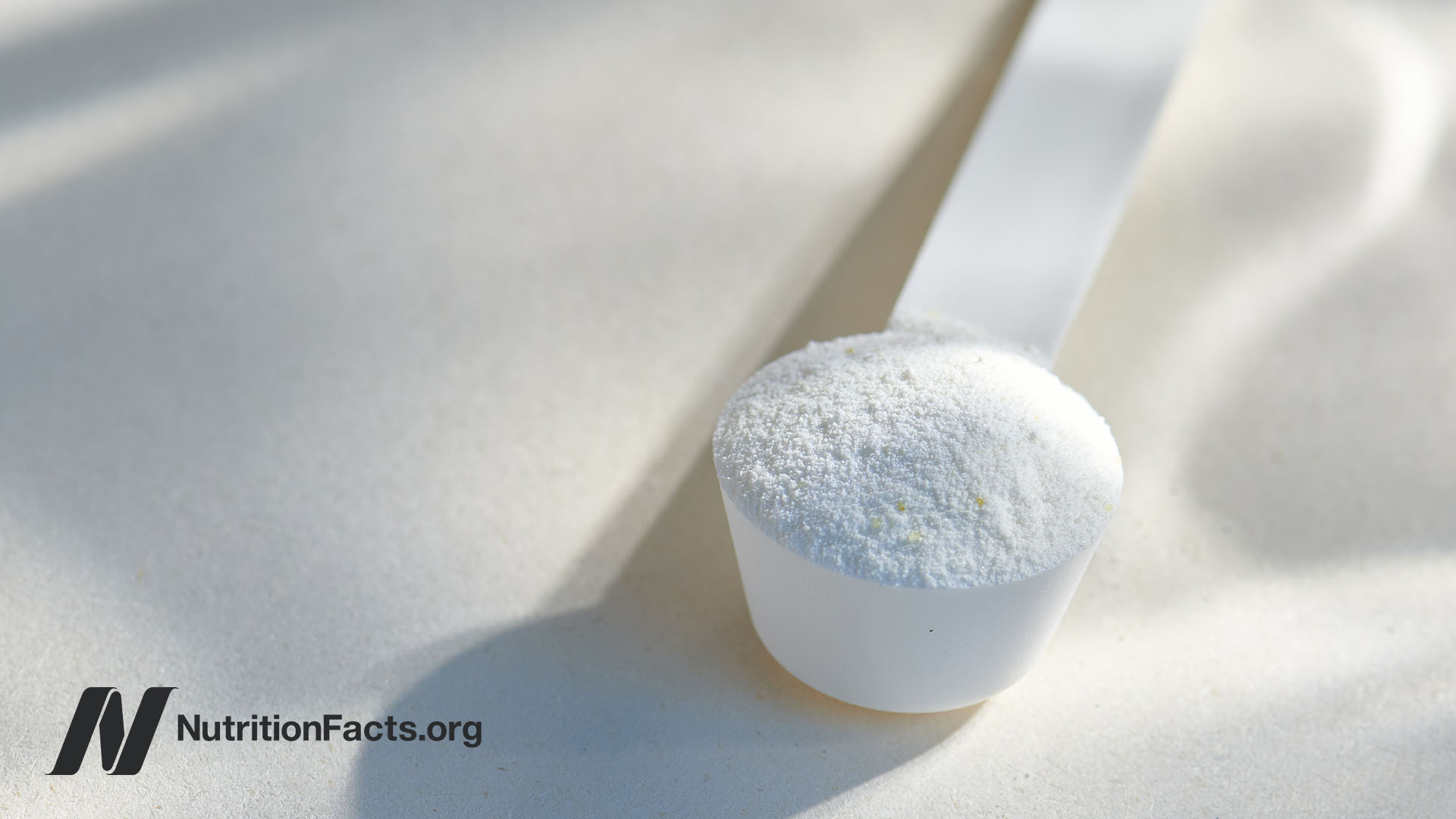 Close up view of a scoop of taurine powder