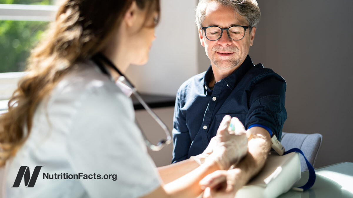 Patient having their blood drawn by a nurse